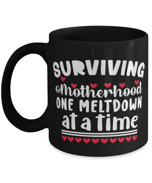 Surviving Motherhood one meltdown at a time, black Coffee Mug, Coffee Cup 11oz. Model 60044