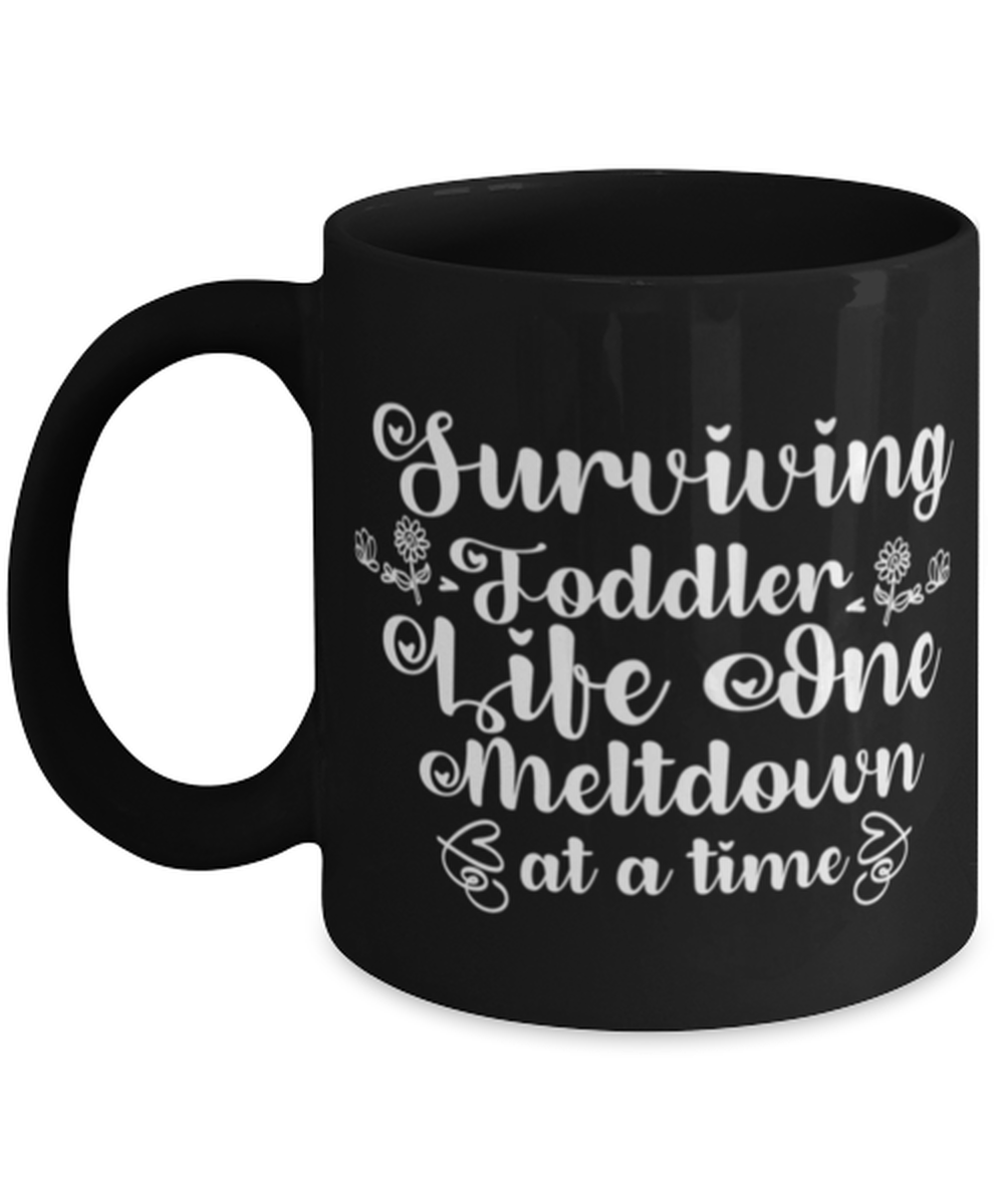 Surviving Toddler Life One Meltdown at a time, black Coffee Mug, Coffee Cup 11oz. Model 60044