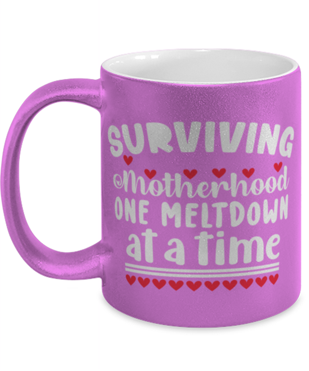 Surviving Motherhood one meltdown at a time, pink Coffee Mug, Coffee Cup metallic 11oz. Model 60044