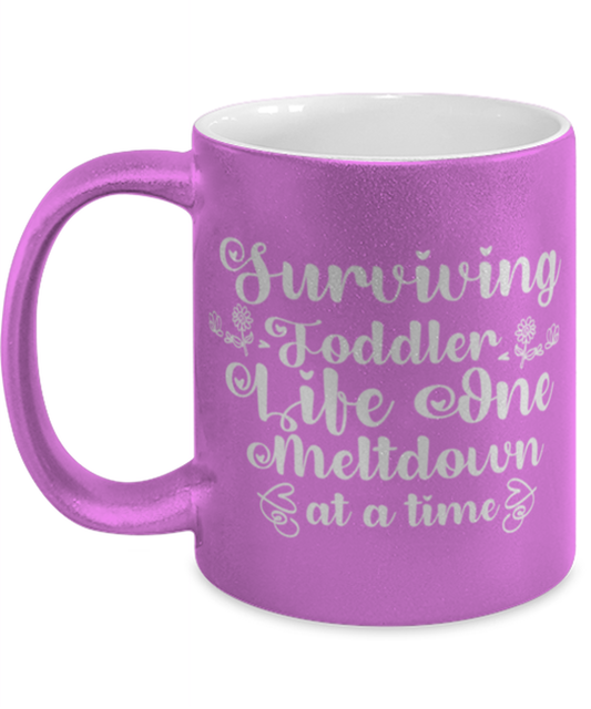 Surviving Toddler Life One Meltdown at a time, pink Coffee Mug, Coffee Cup metallic 11oz. Model 60044