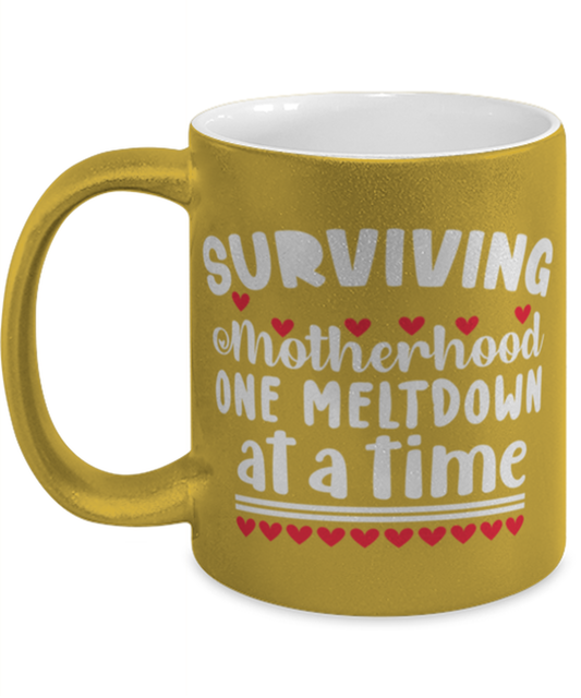 Surviving Motherhood one meltdown at a time, gold Coffee Mug, Coffee Cup metallic 11oz. Model 60044