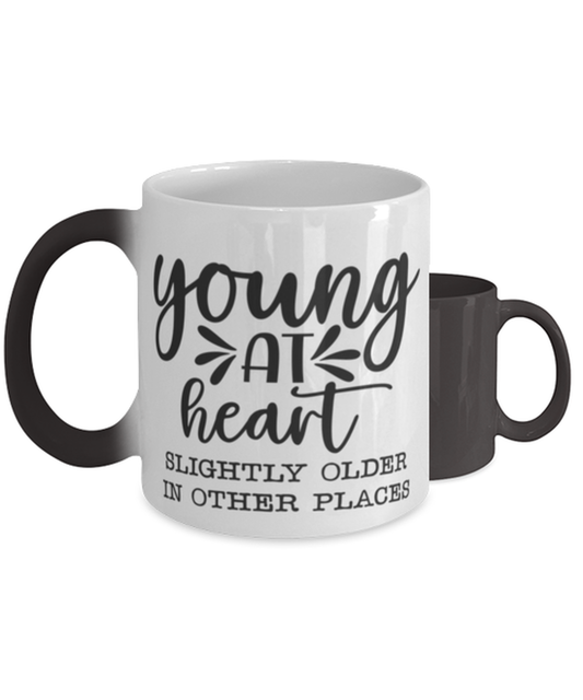 Young at heart slightly older in other places,  Color Changing Coffee Mug, Magic Coffee Cup. Model 60047